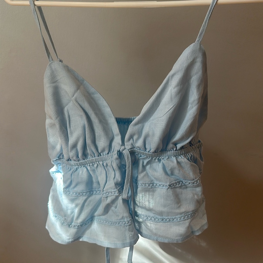 Light blue detailed tie top 
Adjustable straps